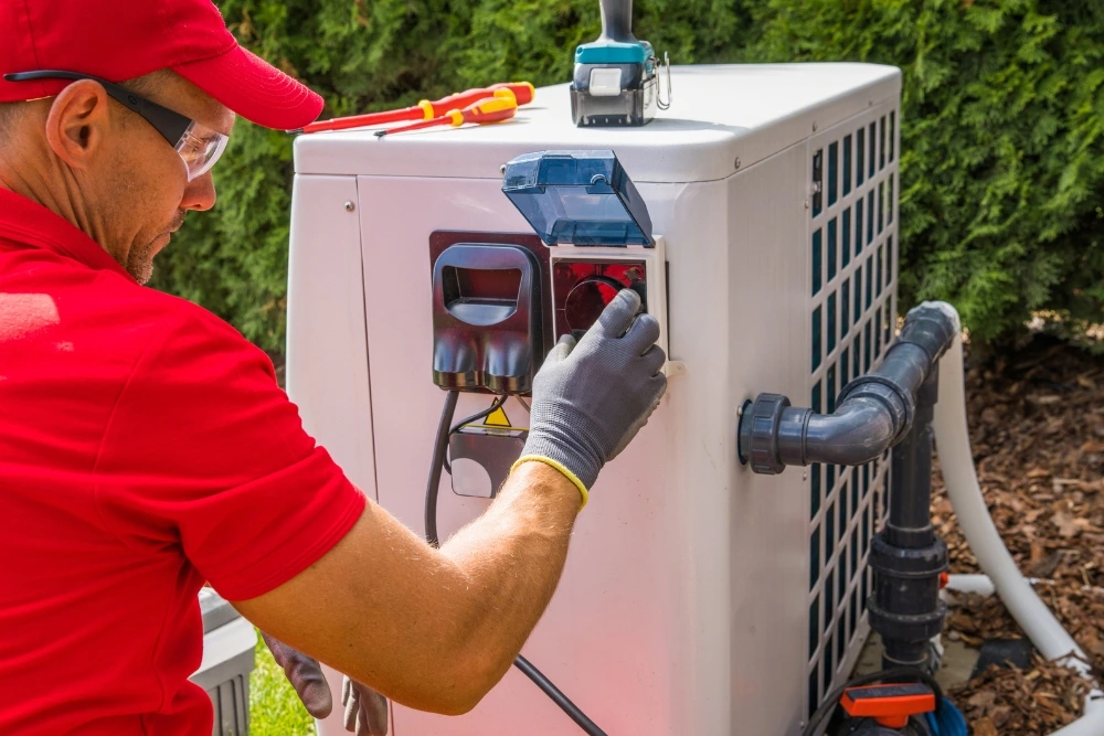 A-technician-is-working-on-the-electrical-components-of-an-outdoor-air-conditioning-unit